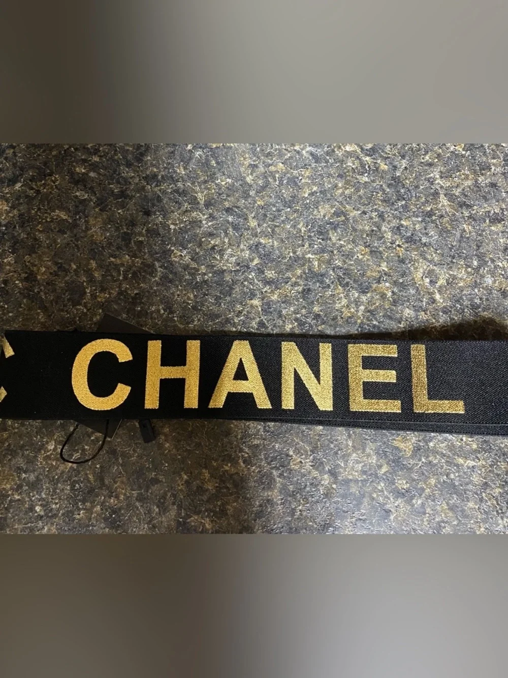 ChaneI Black Metallic Gold Stretch Spellout Headband